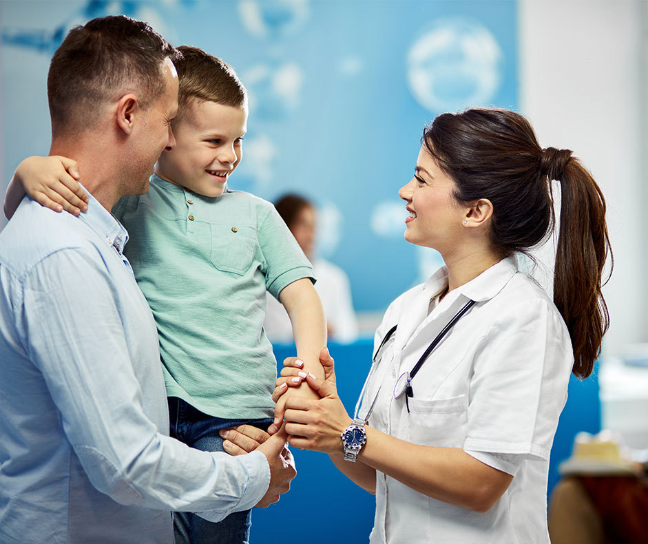 Girl doctor checking in with father and son